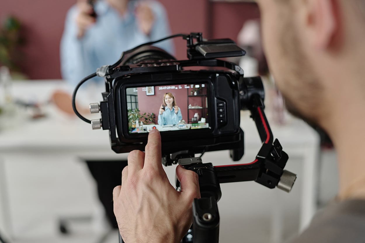 Male Hand on Camera Screen