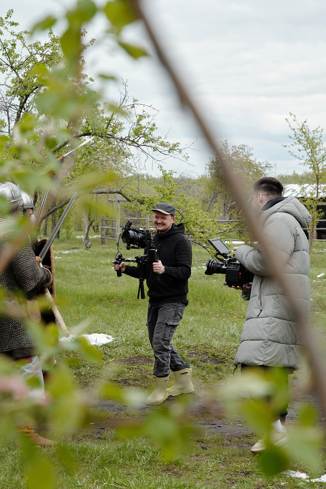 Filming Crew Operating Cameras Outdoors During Daytime